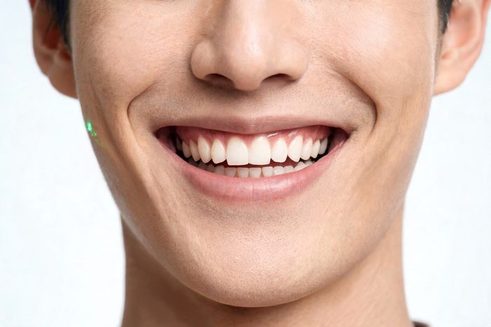 A young man's bright smile